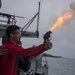 170605-N-LK571-833 WESTERN PACIFIC (June 5, 2017) Gunner’s Mate 2nd Class Deion Mahone, of Indianapolis, fires a flare gun during a live-fire exercise on the Nimitz-class aircraft carrier USS Carl Vinson (CVN 70) fantail. The U.S. Navy has patrolled the I