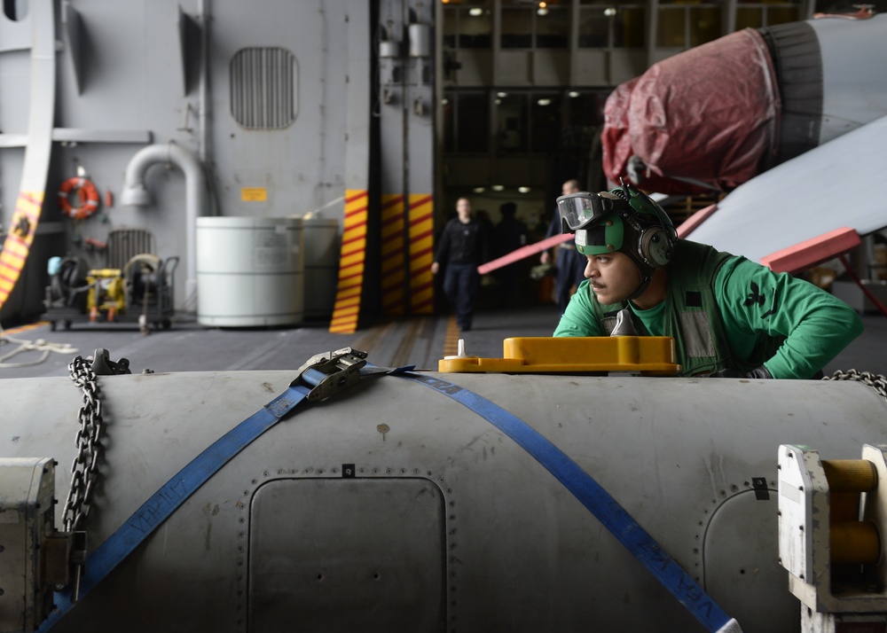 Sailor Pushes Fuel Pod