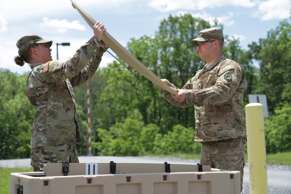 Soldiers set up satellite