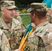 Col. Michael D. Lewis returns the brigade colors to Command Sgt. Maj. Thomas C. Perry