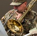 A Soldier with the 56th Army Band plays through a rendition of The Army Song