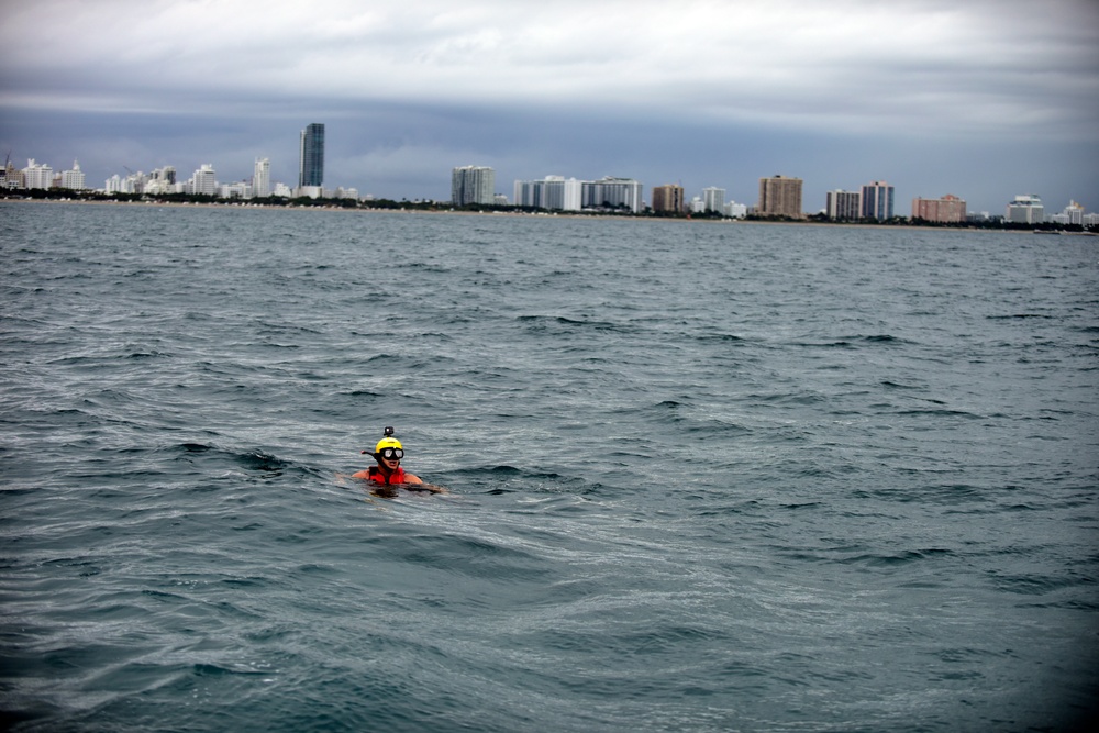 Jim Cantore treads water before mock rescue with Coast Guard Air Station Miami