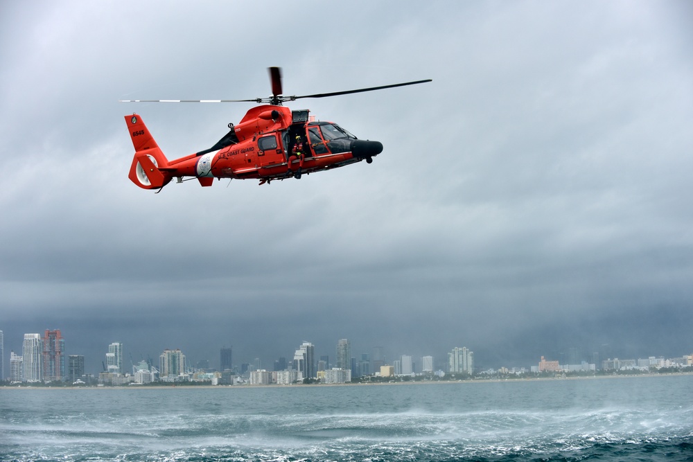 Coast Guard rescue swimmer prepares for free fall deployment