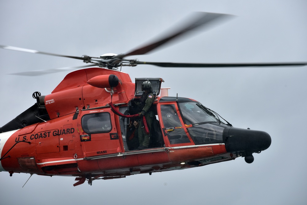 Coast Guard helicopter mechanic prepares for hoist