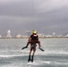 Coast Guard rescue swimmer and Jim Cantore get hoisted off Miami Beach