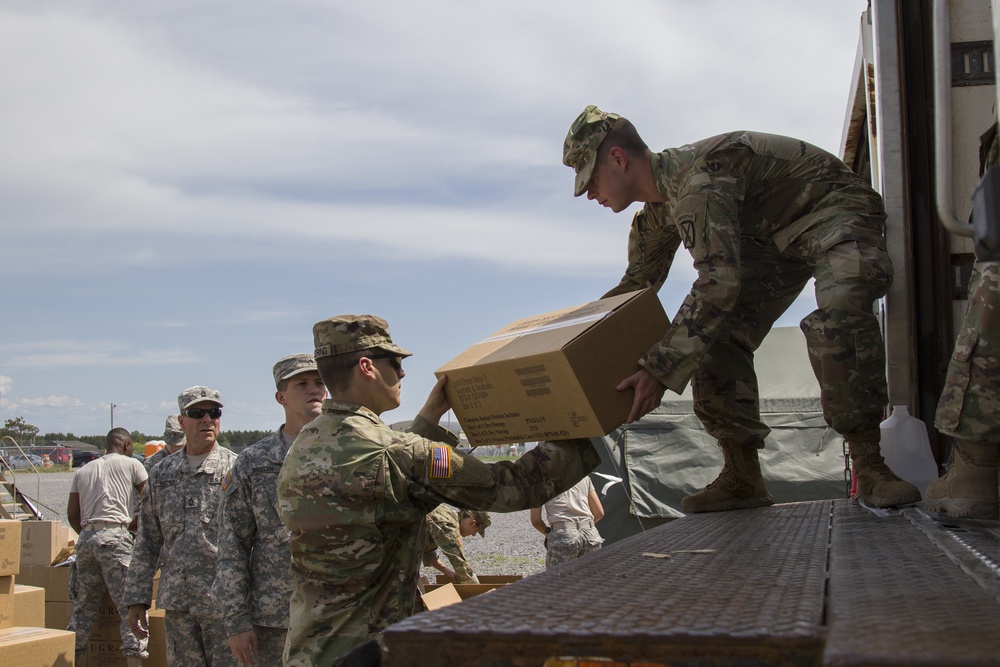 Soldiers Unload a Truck