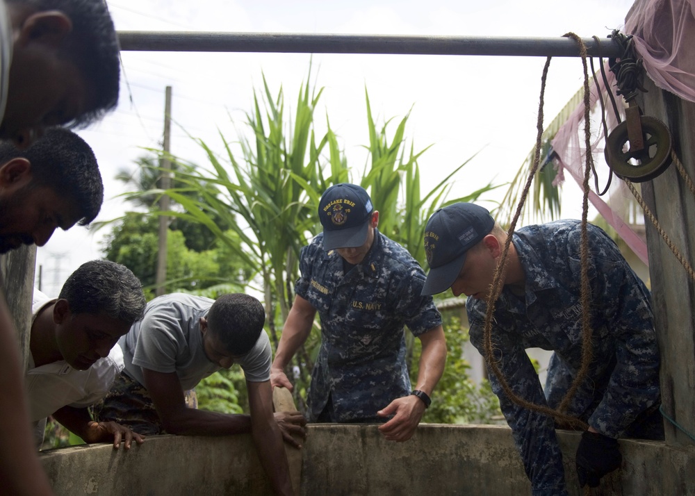 USS Lake Erie (CG 70) provide humanitarian relief