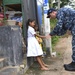 USS Lake Erie (CG 70) Captain interacts with children in Sri Lanka