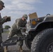 Mechanics Work on Humvee