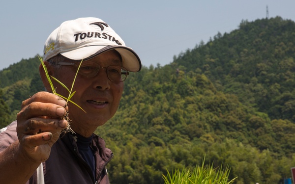 Station residents plant rice with Japanese locals