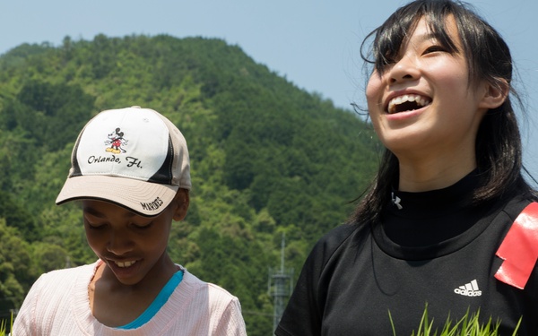 Station residents plant rice with Japanese locals
