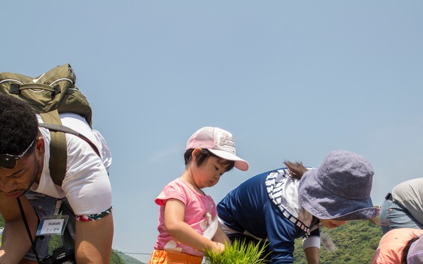 Station residents plant rice with Japanese locals