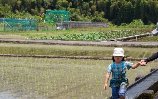 Station residents plant rice with Japanese locals