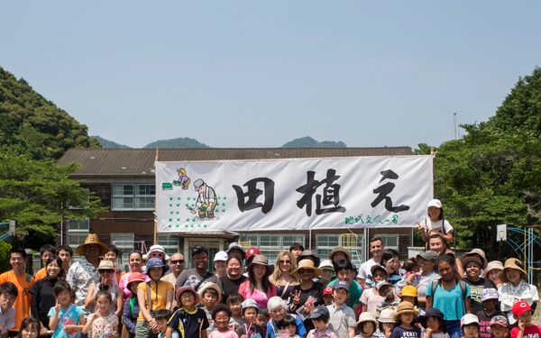 Station residents plant rice with Japanese locals