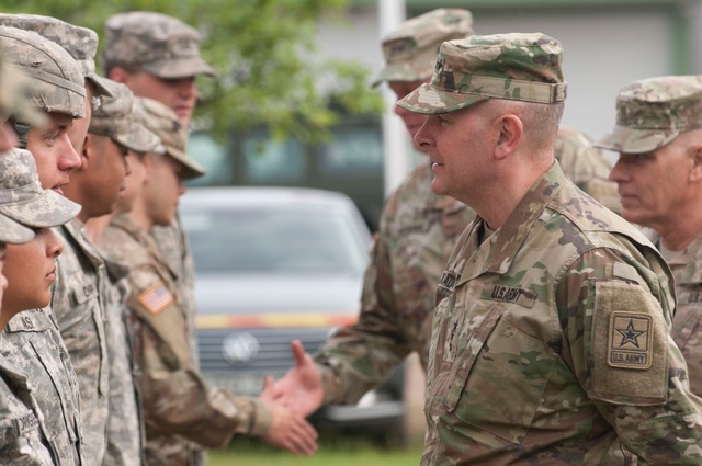 Director of the National Guard, Lt. Gen. Timothy J. Kadavy greets soldiers from HHC 2-136