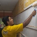 USS Lake Erie (CG 70) Sailor paints a Sri Lankan classroom
