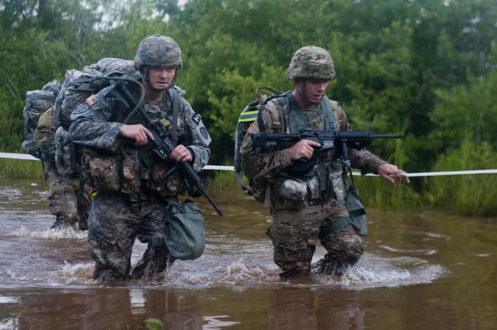 Warrior Crosses Water During Ruck March