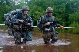 Warrior Crosses Water During Ruck March