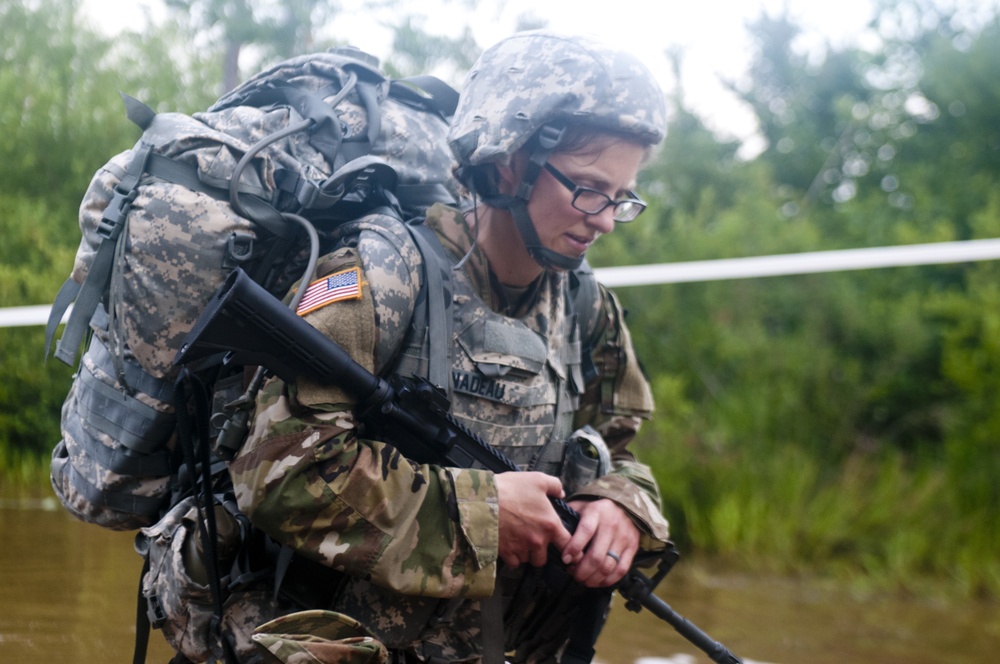 Warrior Crosses Water During Ruck March