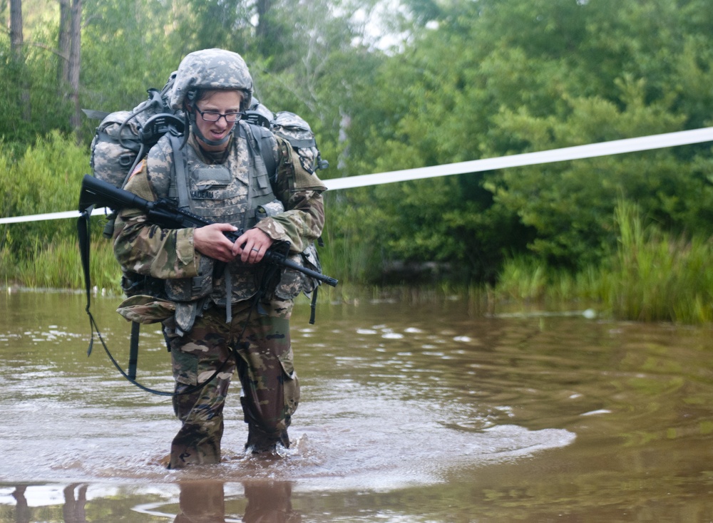 Warrior Crosses Water During Ruck March