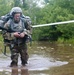 Warrior Crosses Water During Ruck March