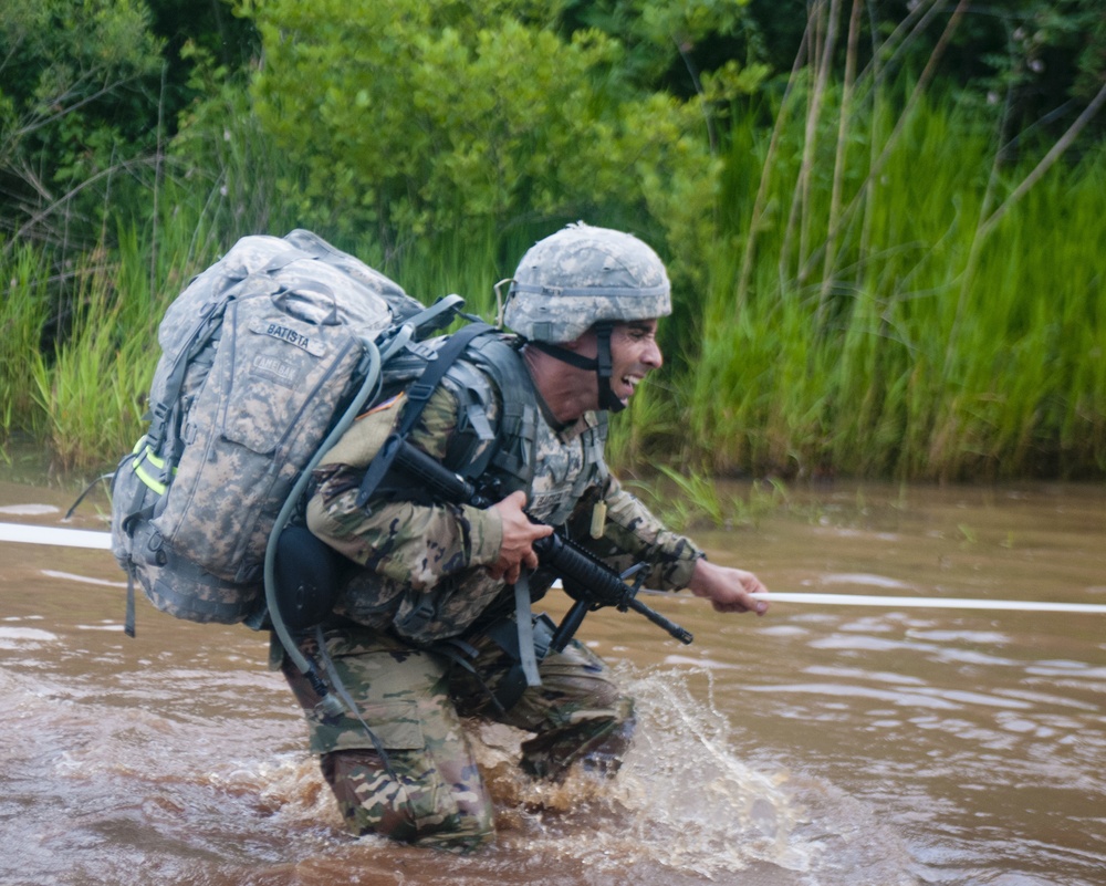 Warrior Crosses Water During Ruck March