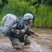 Warrior Crosses Water During Ruck March