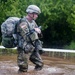 Warrior Crosses Water During Ruck March