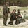 170614-N-PF515-001 Three soldiers in Polish military camouflage uniforms are positioned on sandy terrain with sparse vegetation, likely a coastal dune area. One soldier stands while two others are kneeling or crouching, appearing to communicate via radio equipment. The scene suggests a military training exercise or field operation.