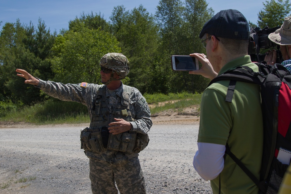 Soldier Speaks with Distinguished Visitors