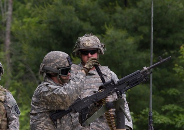 Soldier Loads M240B Machine Gun