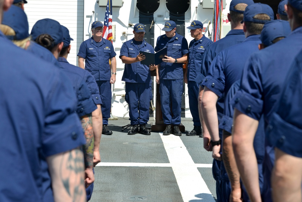 Coast Guard Cutter Munro crewmembers receive a Meritorious Unit Commendation award