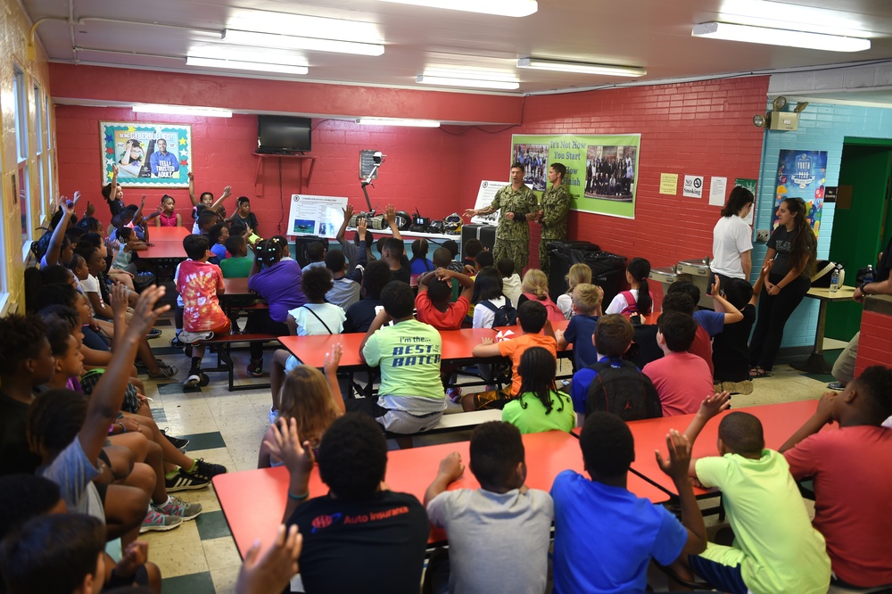 Sailors talk to children at the Shadyside Boys and Girl Club