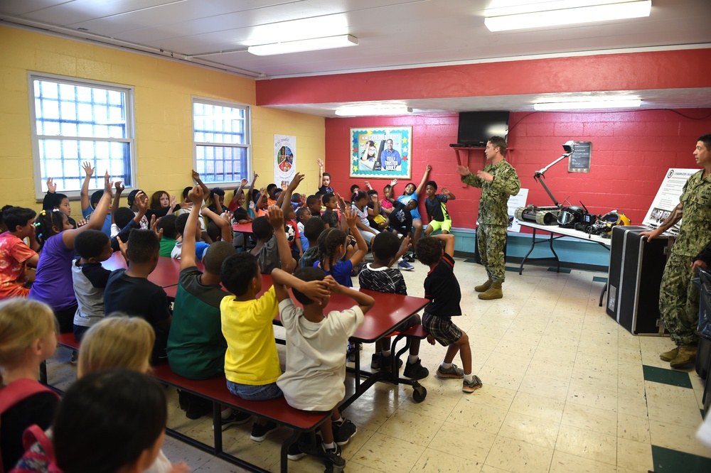 Sailors talk to children at Shadyside Boys and Girl Club