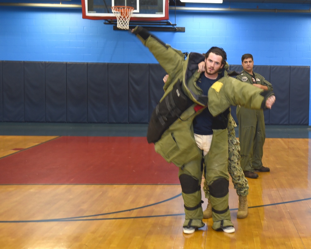 Putting on a bomb suit