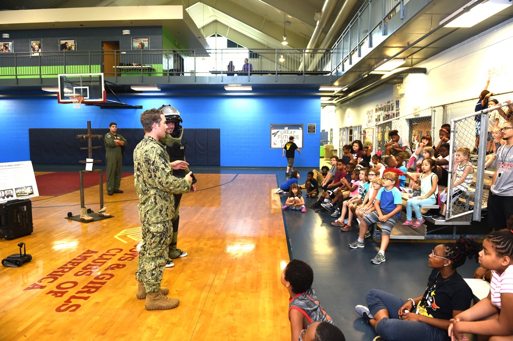 Sailors speak to the children at Estelle S. Campbell Boys and Girl Club