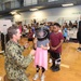 Children try on bomb helmet