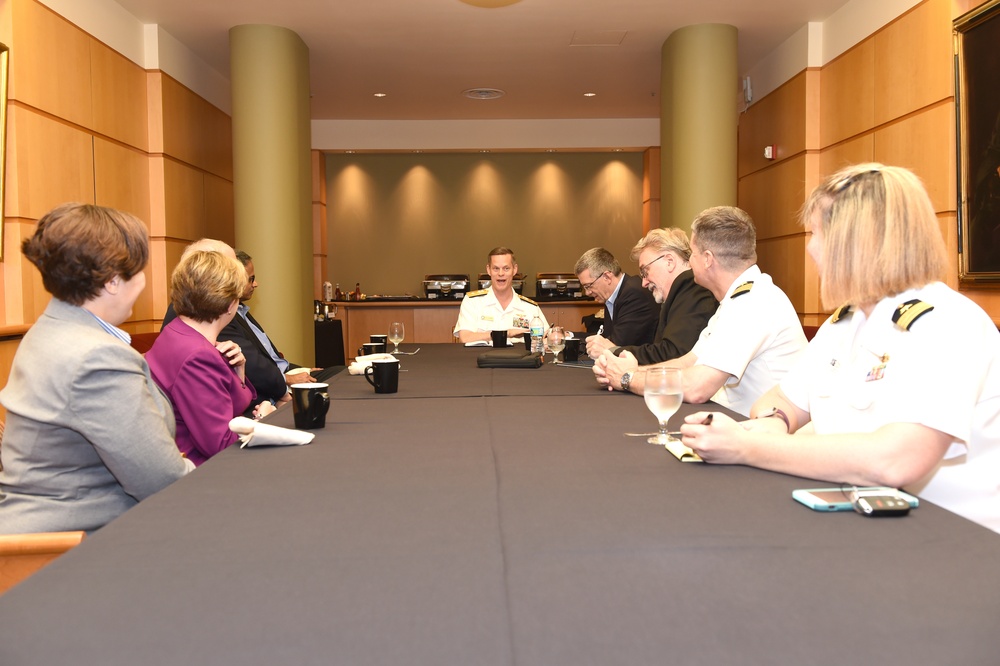 Rear Admiral Jeff Hughes speaks with the executives of Carnegie Mellon University