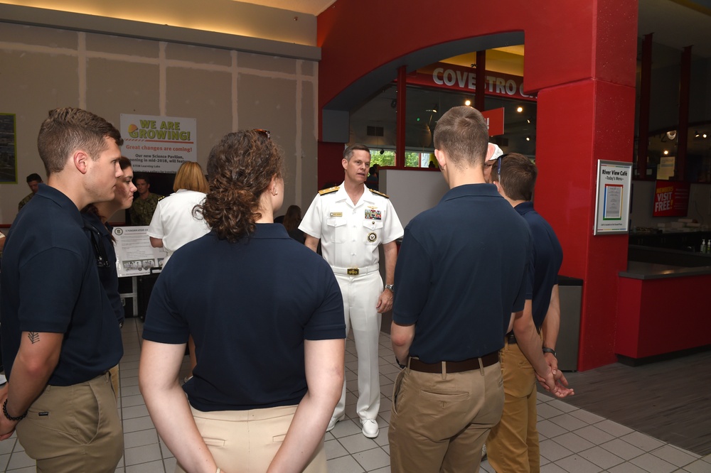 Rear Admiral Jeff Hughes speaks with ROTC Ensign’s