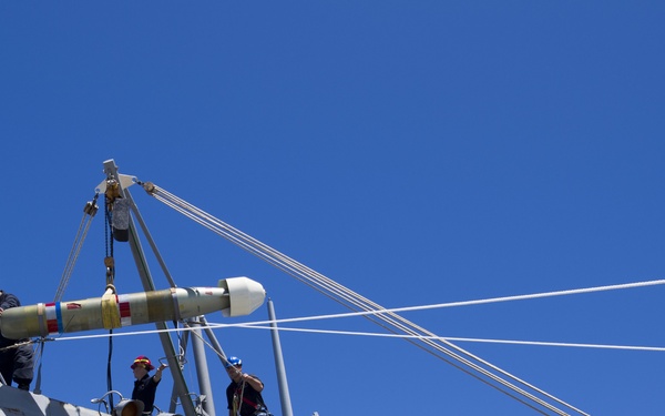 Hoisting an MK 46 torpedo