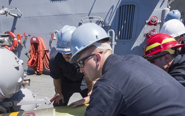 Loading a MK 46 torpedo