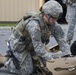 Soldier Assesses Simulated Casualty