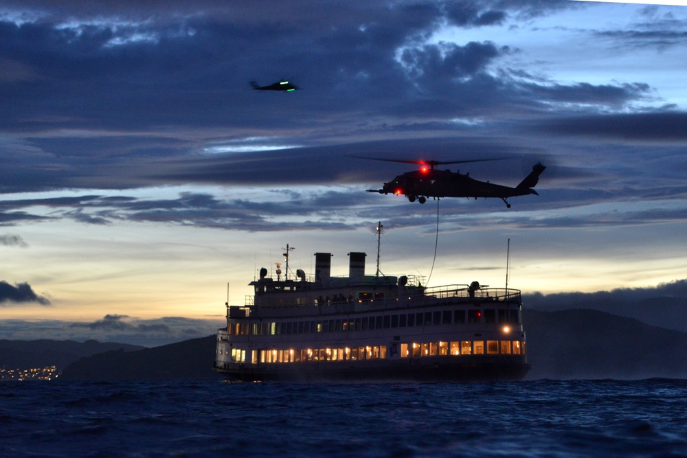 Coast Guard Maritime Safety and Security Team 91109 crewmembers fast-rope with California Air National Guard 129th Rescue Wing aircrews