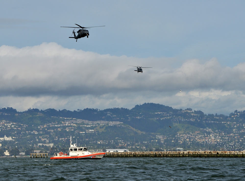 Coast Guard Maritime Safety and Security Team 91109 crewmembers fast-rope with California Air National Guard 129th Rescue Wing aircrews