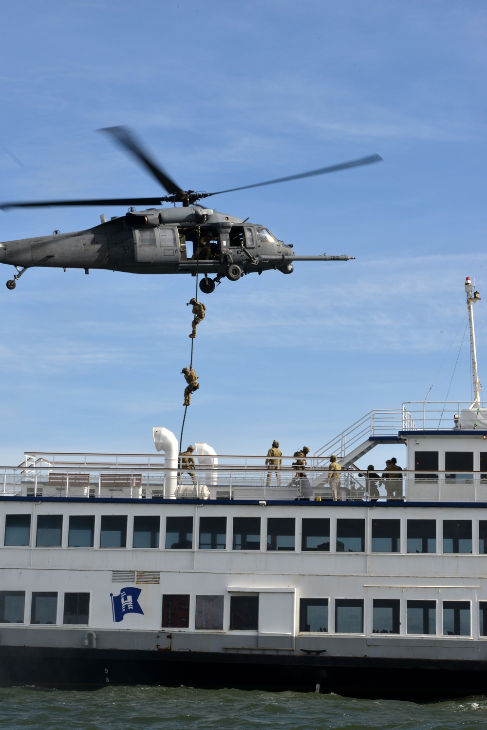 Coast Guard Maritime Safety and Security Team 91109 crewmembers fast-rope with California Air National Guard 129th Rescue Wing aircrews