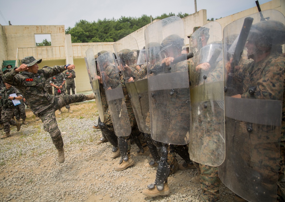 U.S. Marines, Republic of Korea Marines rehearse non-lethal crowd control tactics in South Korea