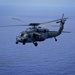 Helicopter Flies Over Pacific Ocean