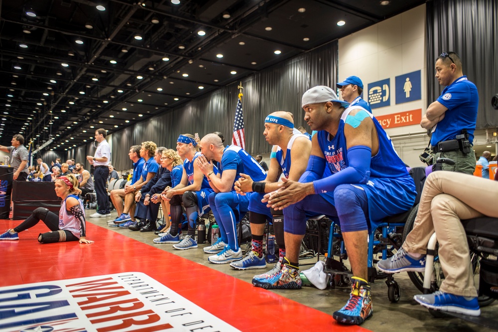 Athletes from Team Air Force watch their team mates compete against Special Operations Command