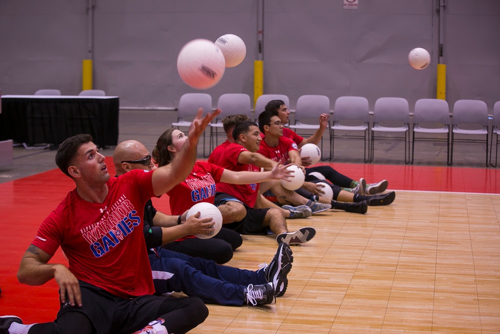 Team Marine Corps athletes prepare for sitting volleyball competition