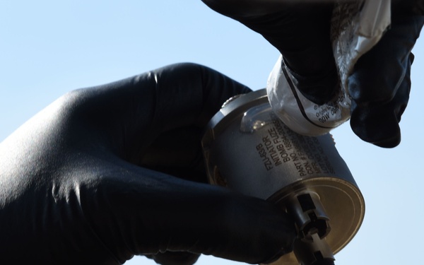 39th ABW commander, 447th EAMXS build bombs